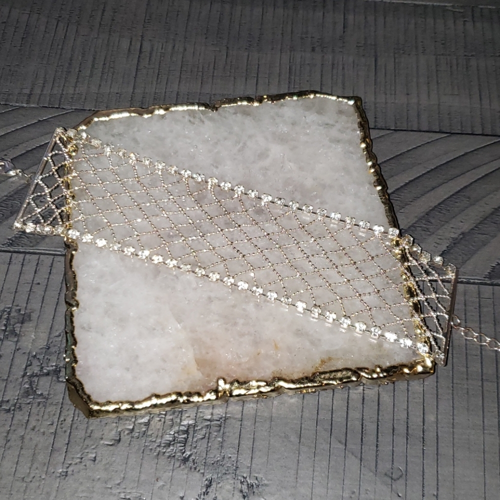 Silver bracelet with stones along edge